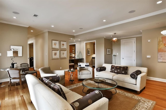 155 Carondelet Plz Unit 600, Saint Louis, MO 63105 - living room featuring light wood finished floors, baseboards, recessed lighting, and crown molding