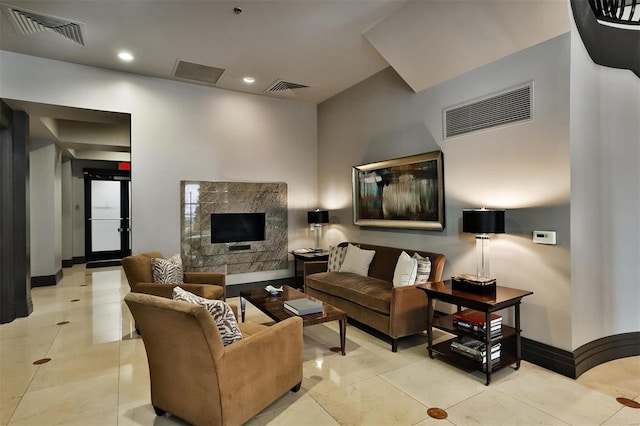 155 Carondelet Plz Unit 600, Saint Louis, MO 63105 - living room featuring recessed lighting, a high end fireplace, baseboards, and tile patterned flooring