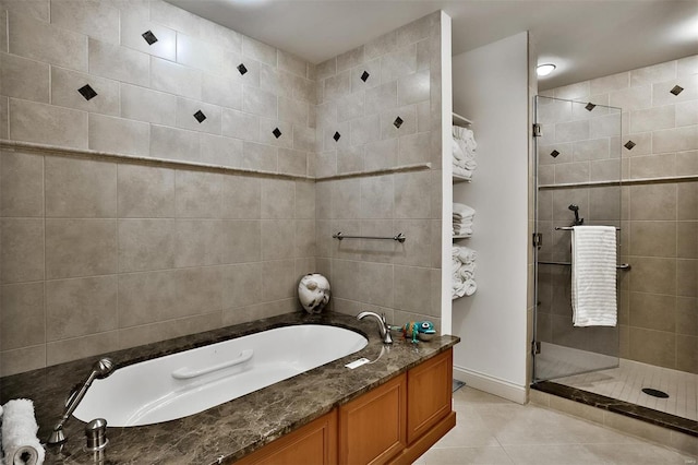 155 Carondelet Plz Unit 600, Saint Louis, MO 63105 - full bath featuring tile patterned floors, a shower stall, a bath, and baseboards