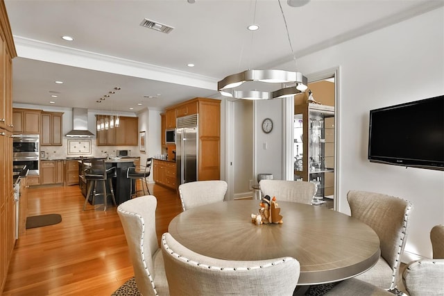 155 Carondelet Plz Unit 600, Saint Louis, MO 63105 - dining area featuring light wood finished floors and recessed lighting