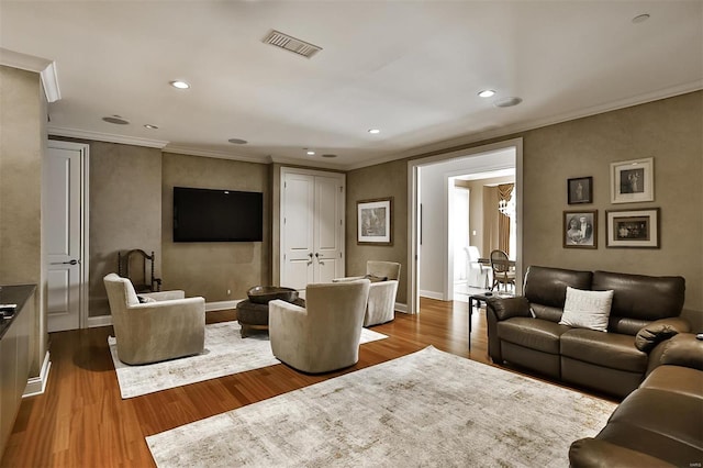 155 Carondelet Plz Unit 600, Saint Louis, MO 63105 - living room featuring wood finished floors, crown molding, baseboards, and recessed lighting