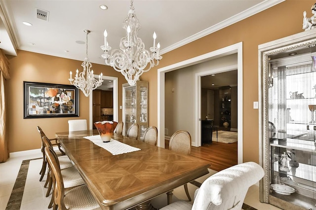 155 Carondelet Plz Unit 600, Saint Louis, MO 63105 - dining room with baseboards, a chandelier, recessed lighting, and crown molding