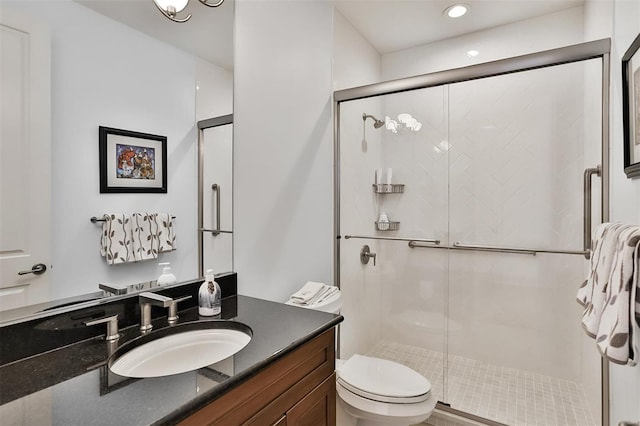 155 Carondelet Plz Unit 600, Saint Louis, MO 63105 - bathroom featuring toilet, a stall shower, vanity, and recessed lighting