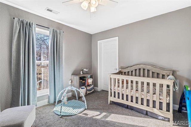 419 Murrill St, Bonne Terre, MO 63628 - bedroom featuring carpet, baseboards, a ceiling fan, and a nursery area