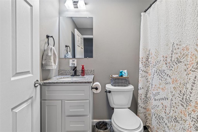 419 Murrill St, Bonne Terre, MO 63628 - bathroom with vanity, toilet, and a shower with shower curtain