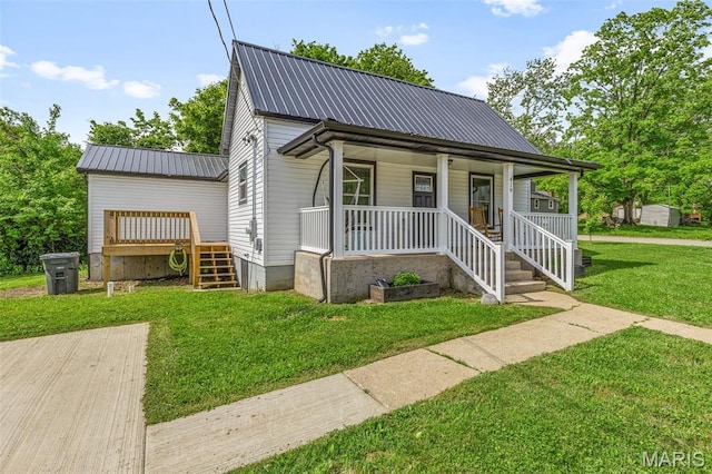 419 Murrill St, Bonne Terre, MO 63628 - bungalow-style home with metal roof, covered porch, a front lawn, and stairway