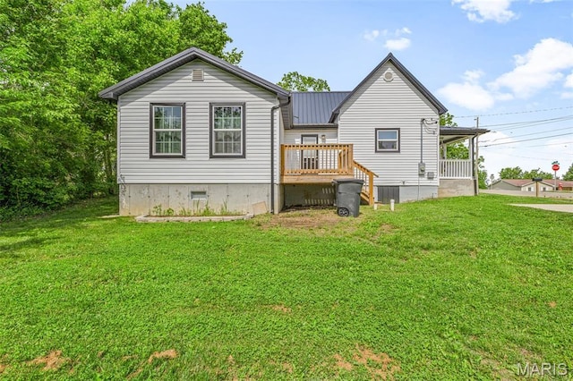 419 Murrill St, Bonne Terre, MO 63628 - rear view of house featuring a lawn, metal roof, and a deck