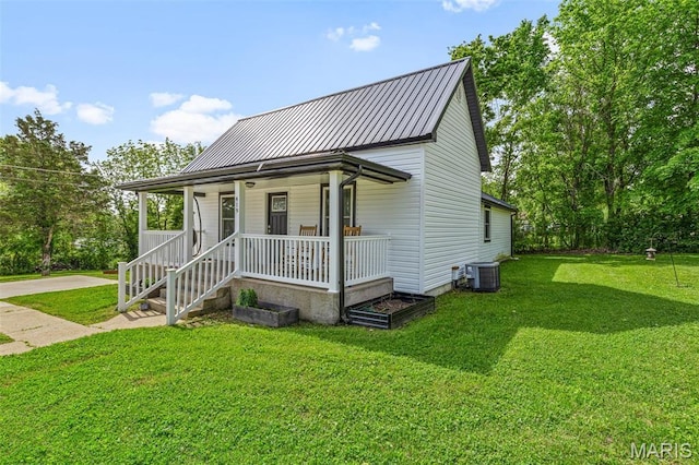 419 Murrill St, Bonne Terre, MO 63628 - view of front of property featuring a porch, metal roof, a front lawn, and cooling unit