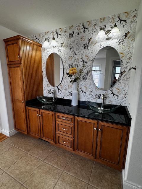 100 Walnut Ct, Saint Robert, MO 65584 - full bath with wallpapered walls, double vanity, tile patterned flooring, and baseboards