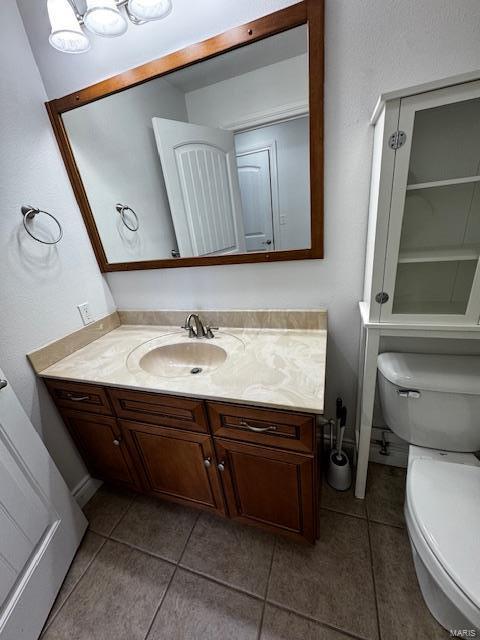 100 Walnut Ct, Saint Robert, MO 65584 - bathroom featuring tile patterned flooring, toilet, and vanity