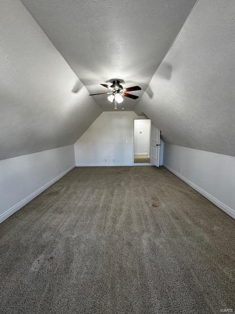 100 Walnut Ct, Saint Robert, MO 65584 - bonus room with a textured ceiling, ceiling fan, lofted ceiling, baseboards, and carpet