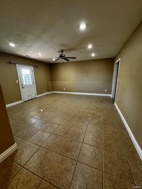 100 Walnut Ct, Saint Robert, MO 65584 - entrance foyer with dark tile patterned flooring, a ceiling fan, recessed lighting, and baseboards