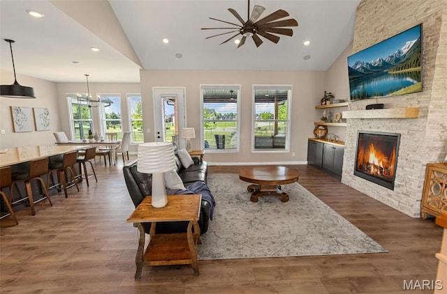 3837 Tanzanite Trl, Edwardsville, IL 62025 - living room featuring plenty of natural light, vaulted ceiling, ceiling fan, a fireplace, and wood finished floors