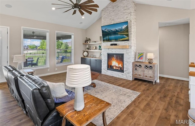 3837 Tanzanite Trl, Edwardsville, IL 62025 - living area with ceiling fan, a stone fireplace, wood finished floors, baseboards, and high vaulted ceiling