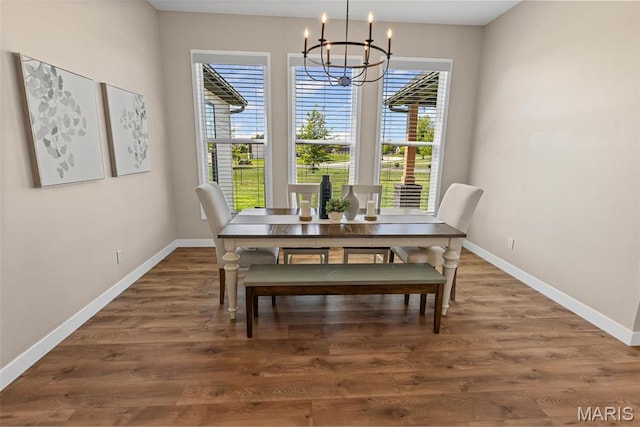 3837 Tanzanite Trl, Edwardsville, IL 62025 - dining space with a chandelier, baseboards, and wood finished floors