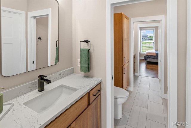 3837 Tanzanite Trl, Edwardsville, IL 62025 - bathroom with vanity, baseboards, and toilet