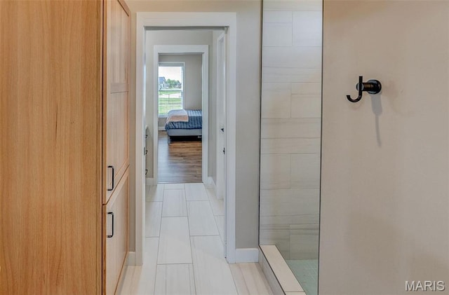 3837 Tanzanite Trl, Edwardsville, IL 62025 - full bath with tiled shower, tile patterned floors, and baseboards