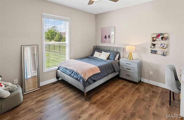3837 Tanzanite Trl, Edwardsville, IL 62025 - bedroom with multiple windows, dark wood-style flooring, baseboards, and ceiling fan