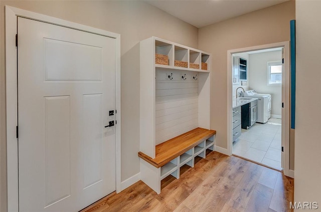 3837 Tanzanite Trl, Edwardsville, IL 62025 - mudroom featuring light wood-type flooring, separate washer and dryer, and baseboards