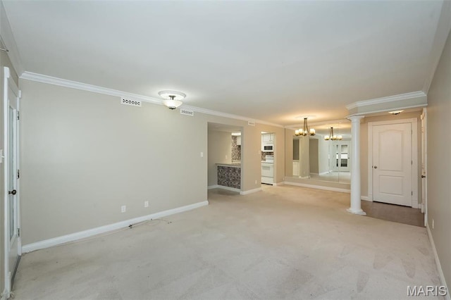 unfurnished living room featuring a chandelier, ornamental molding, light carpet, baseboards, and ornate columns