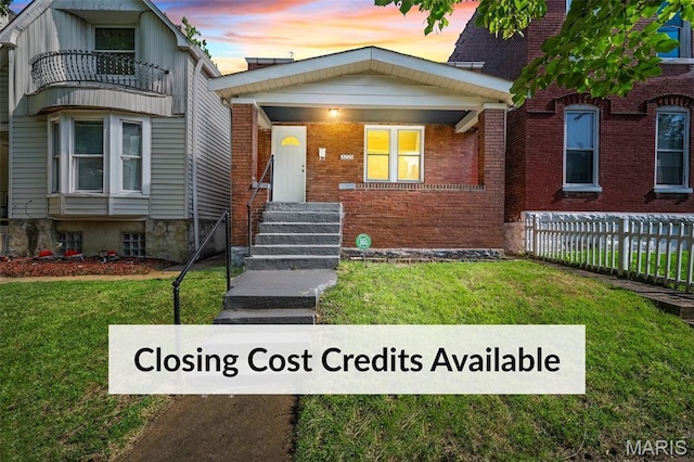 3225 Mount Pleasant St, Saint Louis, MO 63111 - view of front of house featuring brick siding and a balcony