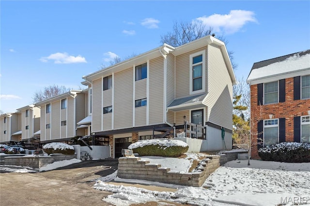 858 Lionsgate Dr, Saint Louis, MO 63130 - view of front facade featuring a garage and asphalt driveway