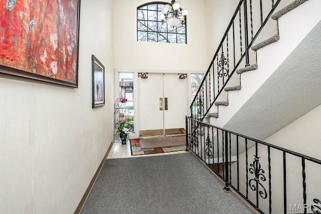 11741 Casa Grande Dr Unit G, Creve Coeur Township, MO 63146 - carpeted foyer entrance featuring a high ceiling, a chandelier, plenty of natural light, and stairs
