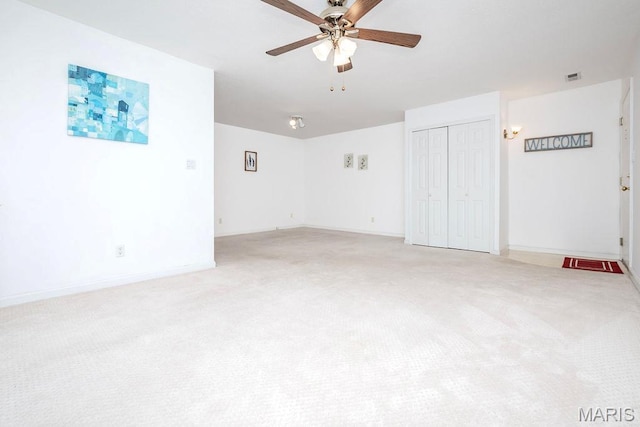 11741 Casa Grande Dr Unit G, Creve Coeur Township, MO 63146 - spare room featuring light colored carpet, a ceiling fan, and baseboards