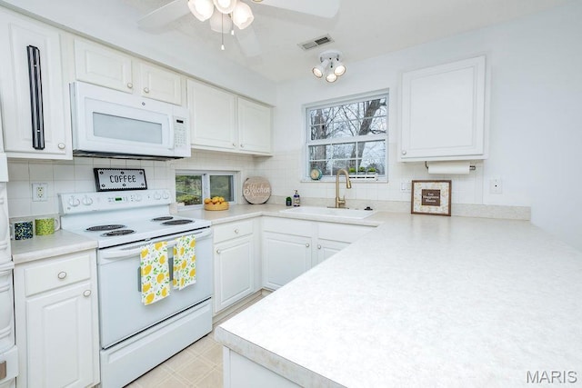 11741 Casa Grande Dr Unit G, Creve Coeur Township, MO 63146 - kitchen with white appliances, a sink, a ceiling fan, and backsplash