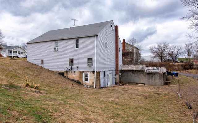 670 S Main St, Saint Clair, MO 63077 - back of house with a lawn and a chimney