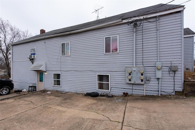670 S Main St, Saint Clair, MO 63077 - back of property with a chimney, a patio, and cooling unit