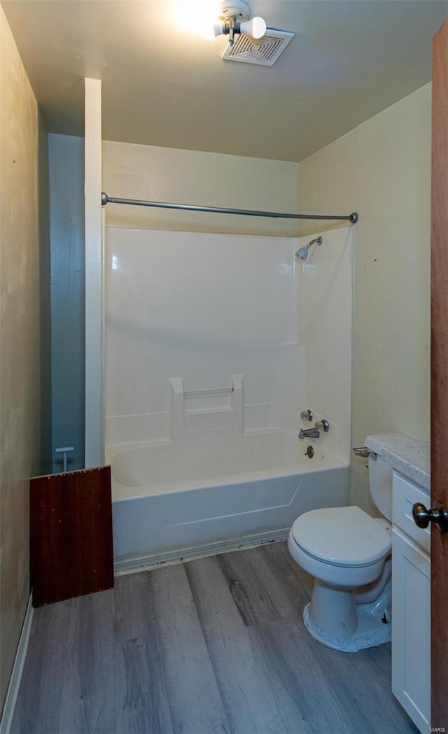 670 S Main St, Saint Clair, MO 63077 - full bathroom with wood finished floors, toilet, shower / bathtub combination, and vanity