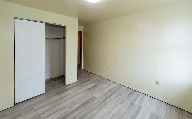 670 S Main St, Saint Clair, MO 63077 - unfurnished bedroom with light wood-style floors, a closet, and baseboards
