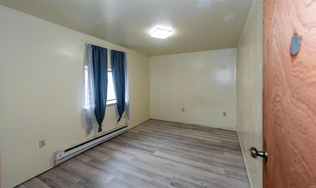 670 S Main St, Saint Clair, MO 63077 - unfurnished room with a baseboard heating unit and wood finished floors