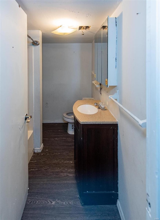 670 S Main St, Saint Clair, MO 63077 - full bathroom featuring vanity, wood finished floors, toilet, and baseboards
