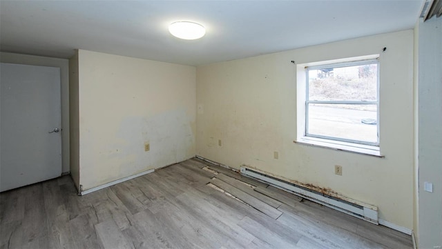 670 S Main St, Saint Clair, MO 63077 - unfurnished room with a baseboard radiator and wood finished floors
