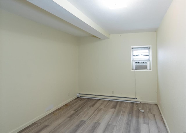 670 S Main St, Saint Clair, MO 63077 - empty room with a baseboard heating unit, light wood-type flooring, cooling unit, and baseboards