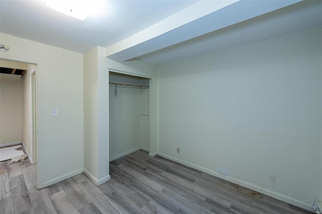 670 S Main St, Saint Clair, MO 63077 - unfurnished bedroom featuring wood finished floors, a closet, and baseboards