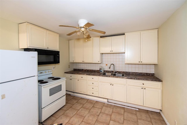 670 S Main St, Saint Clair, MO 63077 - kitchen with white appliances, a sink, a ceiling fan, and dark countertops