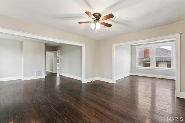 3142 Thelma Ave, Saint Louis, MO 63121 - empty room with dark wood-style flooring, a ceiling fan, and baseboards