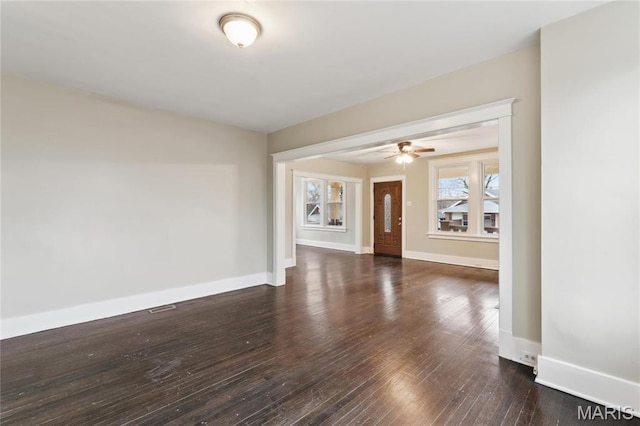 3142 Thelma Ave, Saint Louis, MO 63121 - unfurnished living room featuring hardwood / wood-style floors, ceiling fan, and baseboards