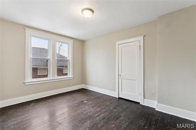 3142 Thelma Ave, Saint Louis, MO 63121 - spare room featuring dark wood-style floors and baseboards