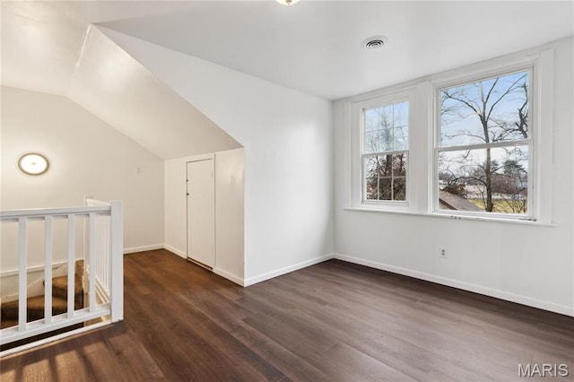 3142 Thelma Ave, Saint Louis, MO 63121 - bonus room featuring dark wood-style flooring, baseboards, and vaulted ceiling
