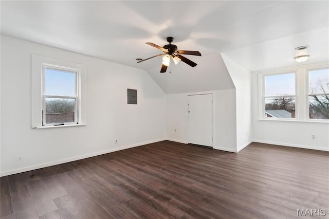 3142 Thelma Ave, Saint Louis, MO 63121 - additional living space featuring electric panel, a ceiling fan, dark wood-style flooring, baseboards, and vaulted ceiling