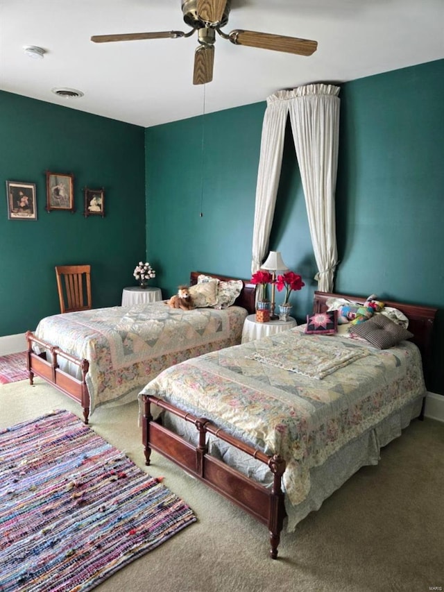 bedroom featuring carpet floors, ceiling fan, and baseboards