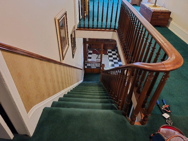 stairs with carpet flooring and baseboards