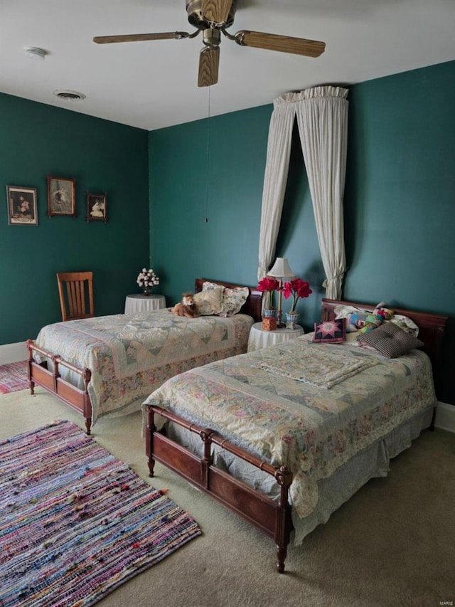 bedroom featuring carpet, a ceiling fan, and baseboards