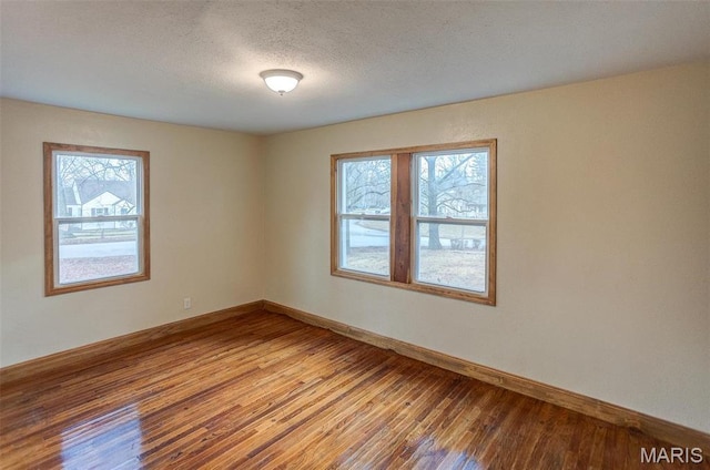 134 N 82nd St, Belleville, IL 62223 - spare room with light wood finished floors, baseboards, and a textured ceiling