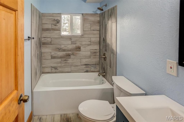134 N 82nd St, Belleville, IL 62223 - full bath with toilet, shower / tub combination, wood finished floors, vanity, and a textured wall