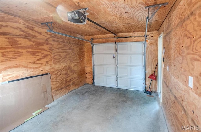 134 N 82nd St, Belleville, IL 62223 - garage featuring a garage door opener and wood walls